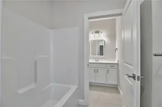 PHOTOS ARE OF ACTUAL HOME. Jack & Jill Bathroom Connects Secondary Bedrooms. 