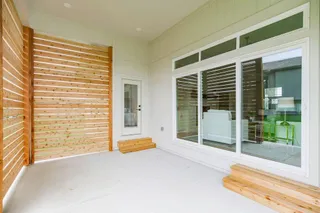 Photo of actual home. Privacy screen on back patio.