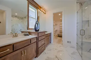 PHOTOS ARE OF A PREVIOUS MODEL AND MAY FEATURE UPGRADES. NOT THE ACTUAL HOME. BUYERS CAN STILL MAKE SELECTIONS! MASTER BATHROOM FEATURES ZERO ENTRY SHOWER, DUAL VANITIES WITH STORAGE CABINET IN BETWEEN.
