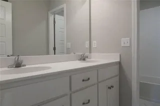 Bathroom with Double Vanity. PICTURE IS OF PREVIOUS SPEC OR MODEL AND MAY FEATURE UPGRADES. NOT ACTUAL HOME.