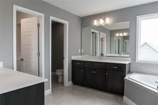 His &  Her Vanities in Master Bathroom. PICTURE IS OF PREVIOUS SPEC OR MODEL AND MAY FEATURE UPGRADES. NOT ACTUAL HOME.
