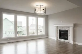 Great Room. PICTURE IS OF PREVIOUS SPEC OR MODEL AND MAY FEATURE UPGRADES. NOT ACTUAL HOME.