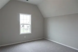 Bedroom 4. PICTURE IS OF PREVIOUS SPEC OR MODEL AND MAY FEATURE UPGRADES. NOT ACTUAL HOME.