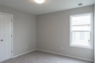Bedroom 3. PICTURE IS OF PREVIOUS SPEC OR MODEL AND MAY FEATURE UPGRADES. NOT ACTUAL HOME.