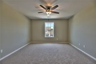 Bedroom 4. PICTURES ARE OF PREVIOUS SPEC OR MODEL HOME AND MAY FEATURE UPGRADES. NOT ACTUAL HOME.