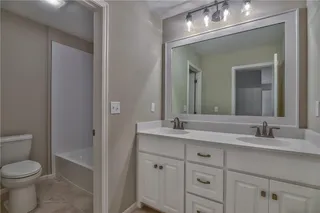 Bathroom with Double Vanity. PICTURES ARE OF PREVIOUS SPEC OR MODEL HOME AND MAY FEATURE UPGRADES. NOT ACTUAL HOME.