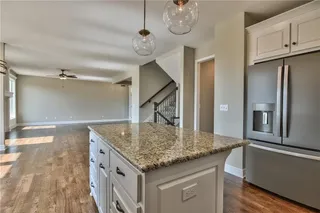Kitchen. PICTURES ARE OF PREVIOUS SPEC OR MODEL HOME AND MAY FEATURE UPGRADES. NOT ACTUAL HOME.