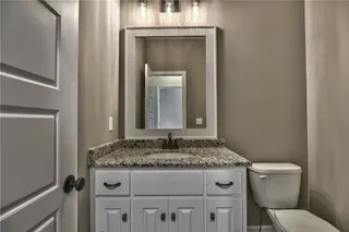 1/2 Bath. PICTURES ARE OF PREVIOUS SPEC OR MODEL HOME AND MAY FEATURE UPGRADES. NOT ACTUAL HOME.