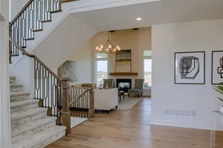 PICTURES ARE OF A PREVIOUS MODEL AND MAY FEATURE UPGRADES. NOT THE ACTUAL HOME. BUYER SELECTIONS ARE STILL AVAILABLE. BEAUTIFUL STAIRCASE AND BALCONY OVERLOOKS THE ENTRYWAY.