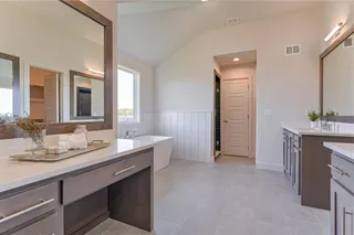 PICTURES ARE OF A PREVIOUS MODEL AND MAY CONTAIN UPGRADES. NOT THE ACTUAL HOME. MASTER BATHROOM HAS DUAL VANITIES, PLUS A MAKEUP VANITY, AND FREE STANDING TUB.
