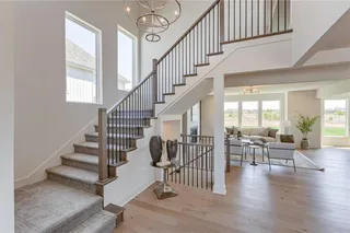 PICTURES ARE OF A PREVIOUS MODEL AND MAY CONTAIN UPGRADES. NOT THE ACTUAL HOME. BEAUTIFUL STAIRCASE LEADS YOU TO THE SECOND LEVEL.