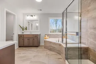 MASTER BATHROOM WITH SEPARATE TUB AND SHOWER, DUAL VANITIES.  PHOTOS ARE OF THE ACTUAL HOME.