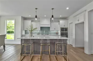 The Durham - 2 Story. Kitchen. Pictures are of Previous Spec, Not Actual Home. Pictures May Feature Upgrades. Please Contact Listing Agent for Stage of Construction, Upgrades, and Available Buyer Selections.