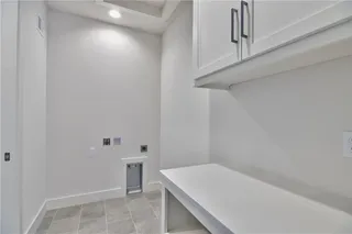 PICTURES ARE OF THE ACTUAL HOME. Laundry room has great access to the master closet.
