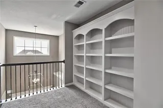 Upstairs loft with bookcases 