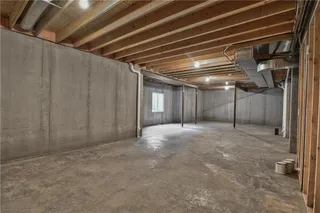 Large unfinished basement get for storage or future finish!