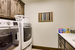 View of Laundry Room.  **PHOTOS ARE OF PREVIOUS CUSTOM HOME, WHICH DOES SHOW NUMEROUS UPGRADES. PICTURES ARE SHOWN TO VIEW OPTIONAL UPGRADED FEATURES. NOT ACTUAL HOME.**