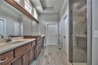 The Sonoma Reverse -  PICTURES ARE OF PREVIOUS SPEC HOME AND MY FEATURE UPGRADES - Master Bathroom with Upgraded Polished Tile, Dual Vanities and Zero Entry Shower with Dual Shower Heads