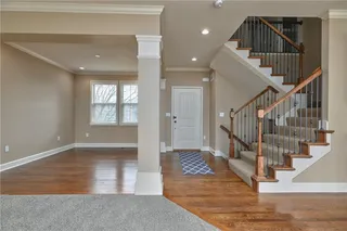 Neutral colors, iron spindles, and gleaming hardwoods show this home is ready for you!