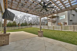 Built-in TV comes with the home, but is excluded from inspections. Pergola provides some shade for your entertaining.