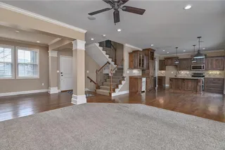 View of the front entry leading into a formal dining room with hardwood floors.  Open first level!