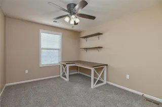 Bedroom two has ceiling fan and desk stays from previous owner for a wonderful functional office.