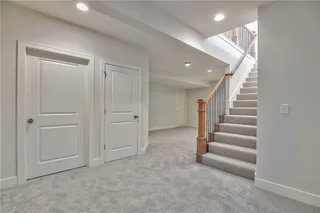 Pictures are of a Previous Model AND MAY FEATURE UPGRADES. SEVERAL BUYER SELECTIONS ARE STILL AVAILABLE. PLEASE CONTACT LISTING AGENT FOR DETAILS.Basement with light carpet