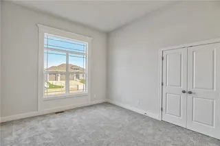 Pictures are of a Previous Model AND MAY FEATURE UPGRADES. SEVERAL BUYER SELECTIONS ARE STILL AVAILABLE. PLEASE CONTACT LISTING AGENT FOR DETAILS.Bedroom #2 featuring a wealth of natural light and light carpet