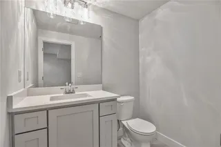 Pictures are of a Previous Model AND MAY FEATURE UPGRADES. SEVERAL BUYER SELECTIONS ARE STILL AVAILABLE. PLEASE CONTACT LISTING AGENT FOR DETAILS.Bathroom #3 with vanity, toilet and shower.