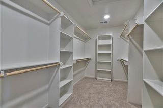 Master Closet. PICTURES ARE OF PREVIOUS SPEC OR MODEL HOME AND MAY FEATURE UPGRADES. NOT ACTUAL HOME.