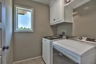 Laundry Room. PICTURES ARE OF PREVIOUS SPEC OR MODEL HOME AND MAY FEATURE UPGRADES. NOT ACTUAL HOME.