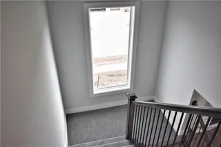 The Durham - 2 Story. Stairwell. Pictures are of Previous Spec, Not Actual Home. Pictures May Feature Upgrades. Please Contact Listing Agent for Stage of Construction, Upgrades, and Available Buyer Selections.