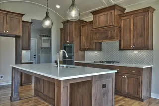 The Sonoma Reverse -Pictures are Not of Actual Home- Kitchen with Barrel Vault Ceiling, Quartz Island and Countertops and Upgraded Herringbone Tile Backsplash