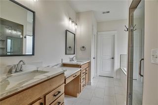 Master Bath Features upgraded Quartz Counter Tops, Rectangular sinks, Vanity Table, upgraded 12X24 Tile, Walk in Tiled Shower - Tile to the Ceiling and Soaker Tub. Picture is of Actual Home. 