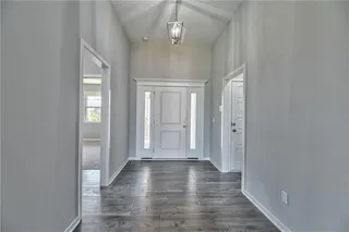 Front Entry with Wood Floors. Picture is of Actual Home. 