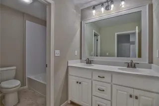Bathroom with Double Vanity. PICTURES ARE OF PREVIOUS SPEC OR MODEL HOME AND MAY FEATURE UPGRADES. NOT ACTUAL HOME.