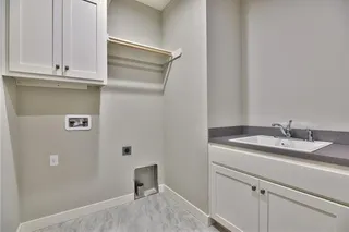 The Sonoma Reverse - Pictures are Not of Actual Home - Laundry Room with Built-in Upper Cabinet and Utility Sink