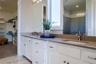 Dual Vanity in Master Bathroom. PICTURES ARE OF PREVIOUS SPEC OR MODEL HOME AND MAY FEATURE UPGRADES. NOT ACTUAL HOME.