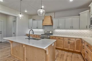 View into Kitchen. Soft Closed Cabinets and Drawers. Quartz Counter Tops, Gas Cook Top, Vent Hood, Stainless Steel Appliances, Super Single Stainless Steel Sink and Wider Plank Hardwood Floors. So Many Upgrades! Picture is of Actual Home. 