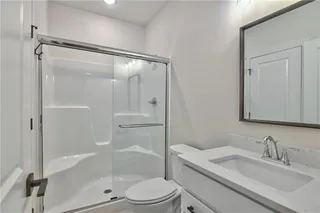Private Bath in Bedroom #4 features Quartz Vanity Top and Walk In Closet. Picture is of Actual Home. 