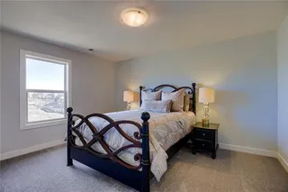 Secondary Bedroom on Upper Level.PICTURES ARE OF PREVIOUS SPEC OR MODEL HOME AND MAY FEATURE UPGRADES. NOT ACTUAL HOME.