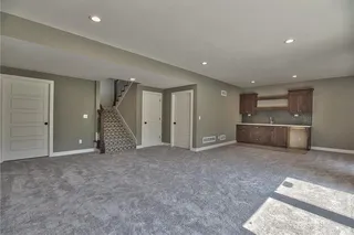 The Sonoma Reverse - Pictures are Not of Actual Home - Lower Level Recreation Room with Bar with Upper and Lower Cabinets and Upgraded Herringbone Tile Backsplash