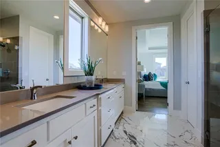 Dual Vanity in Master Bathroom.PICTURES ARE OF PREVIOUS SPEC OR MODEL HOME AND MAY FEATURE UPGRADES. NOT ACTUAL HOME.