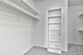 Huge Walk In Closet with tons of hanging. Picture is of Actual Home. 