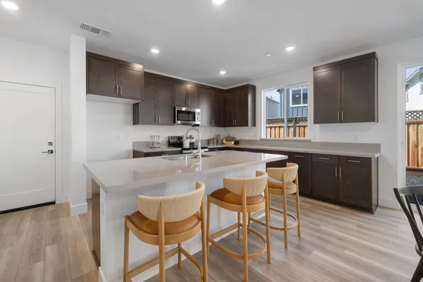 Open kitchen island in Plan 3 Windsor at Old Redwood Village