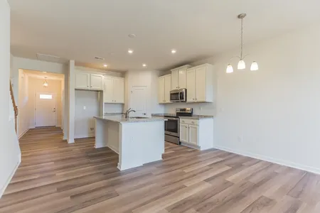 Open floor dining area and kitchen at Elm