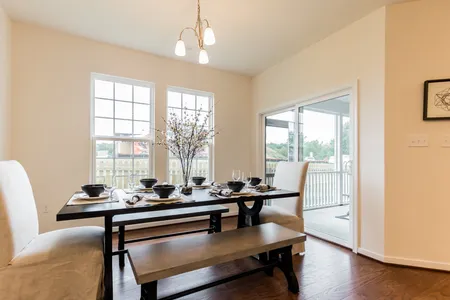 Dining room area with sliding backdoor at The Reed