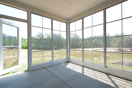 Porch/Exterior sunroom at The Mosaic at West Creek: Willis