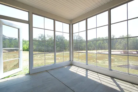 Porch/Exterior sunroom at The Mosaic at West Creek: Willis
