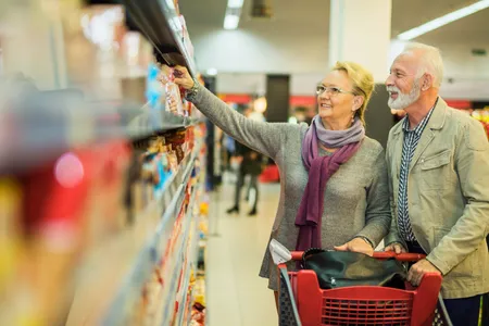 55+ Couple Shopping at Grocery Store
